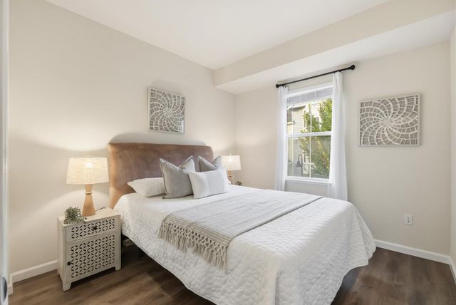 a bedroom with bed and a window