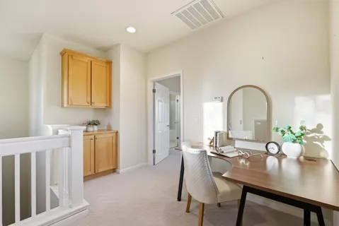 a view of a dining room with furniture and window