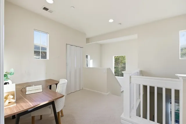 a workspace with furniture and window