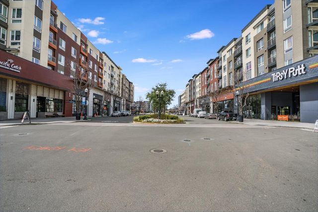 a view of a street with a building in the background