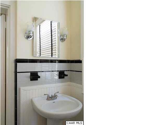1810 Winston Road Charlottesville, VA 22903 - Photo 11 of 22 a bathroom with a sink and a mirror