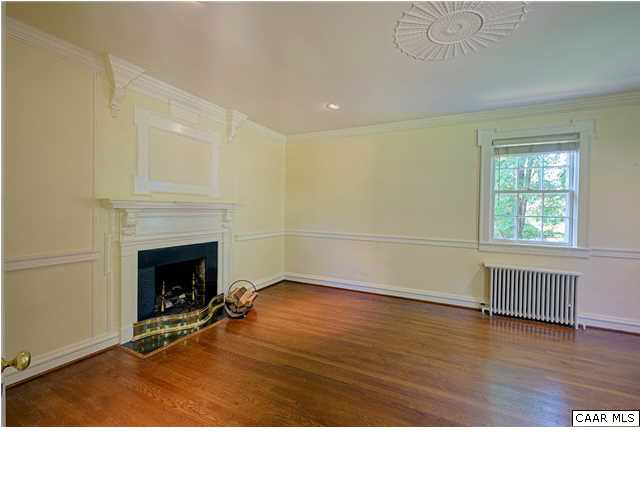 1810 Winston Road Charlottesville, VA 22903 - Photo 3 of 22 a room with wooden floor and fireplace