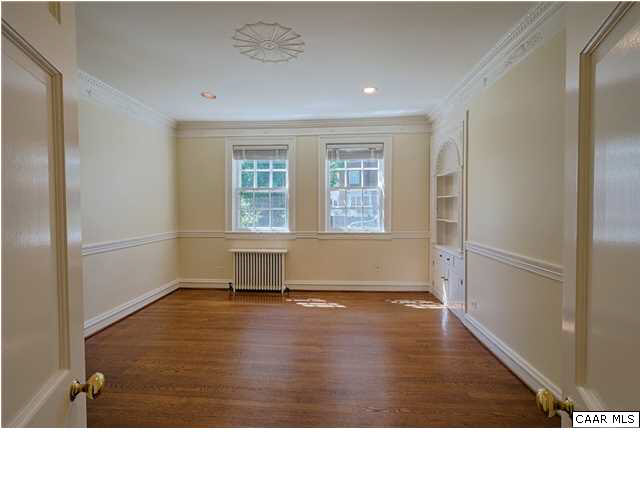 1810 Winston Road Charlottesville, VA 22903 - Photo 6 of 22 a view of an empty room with wooden floor and a window