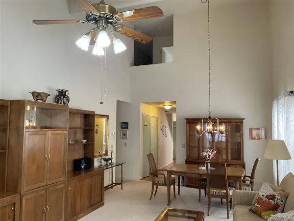 a kitchen with refrigerator and cabinets