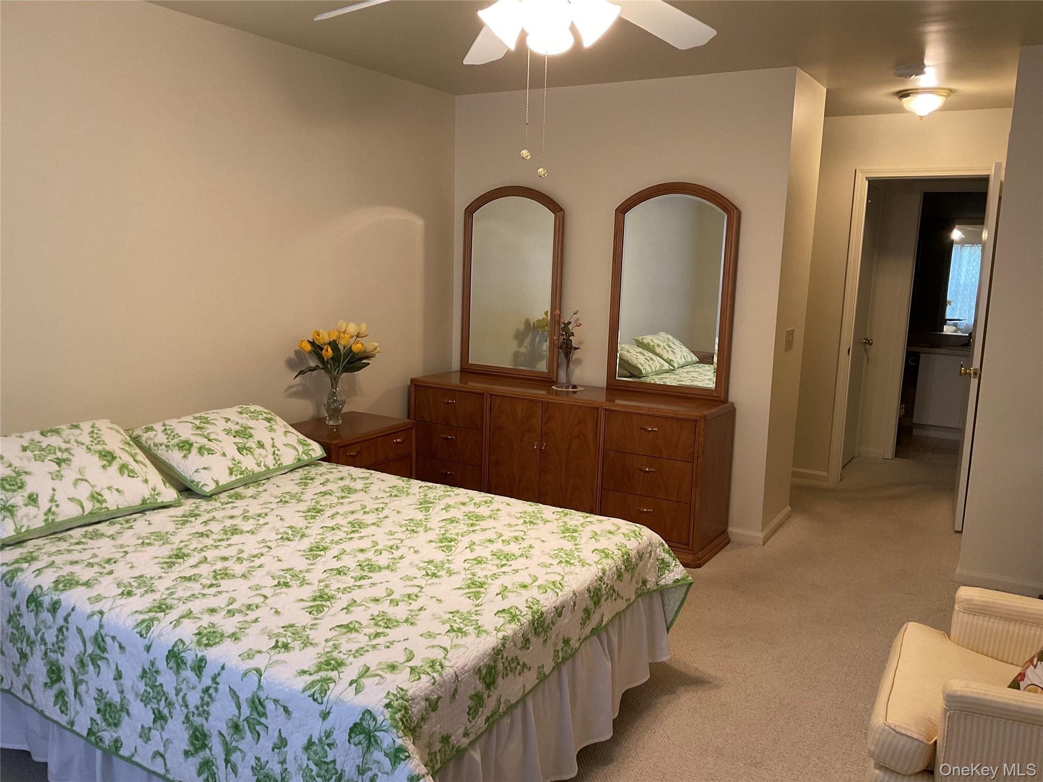 17 Tall Tree Lane Poughkeepsie, NY 12601 - Photo 15 of 31 a bedroom with a bed and a dresser with mirror