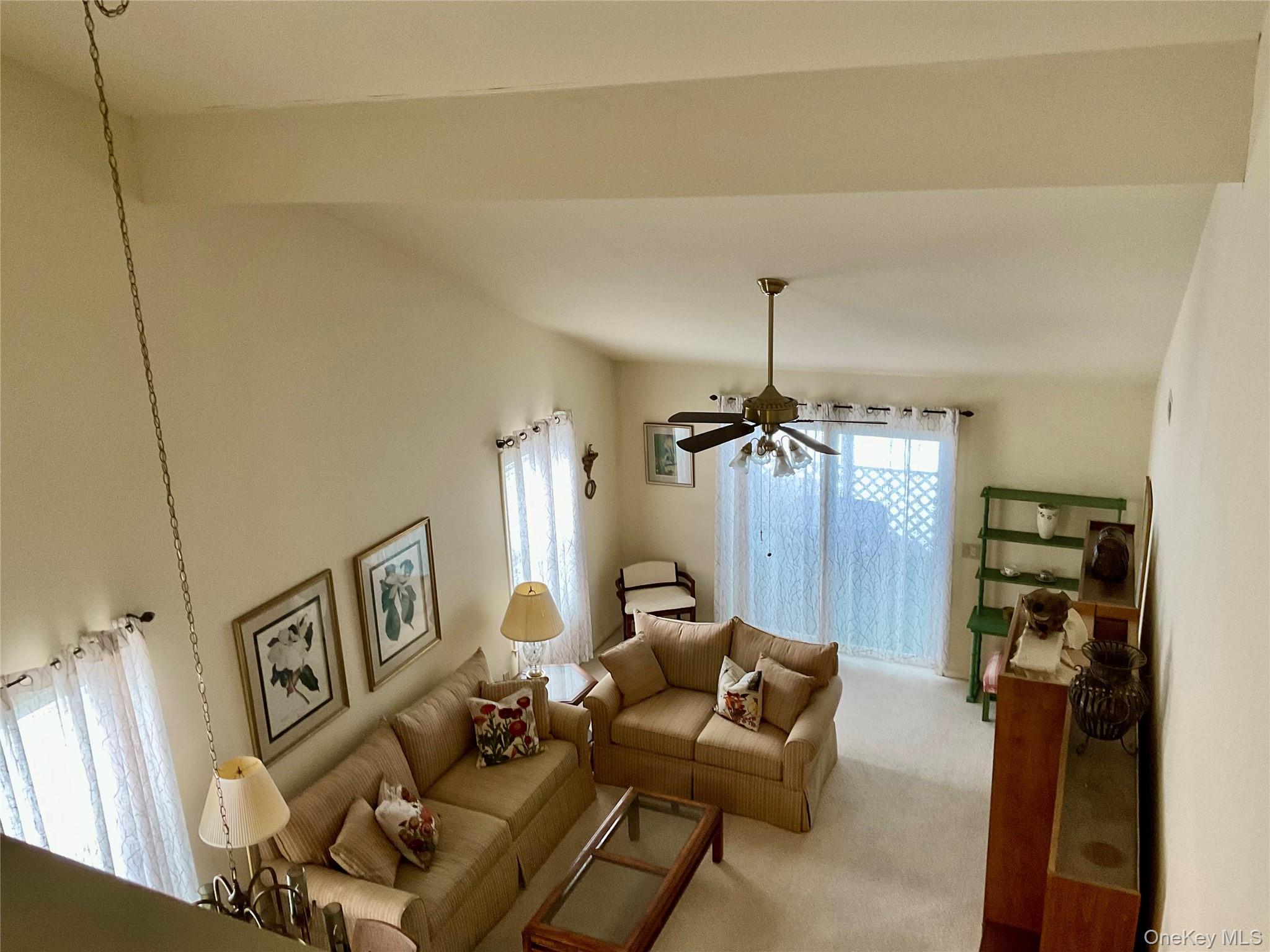 17 Tall Tree Lane Poughkeepsie, NY 12601 - Photo 18 of 31 a living room with furniture and a chandelier