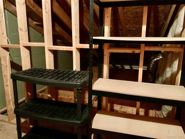 a view of a chairs and table in a balcony