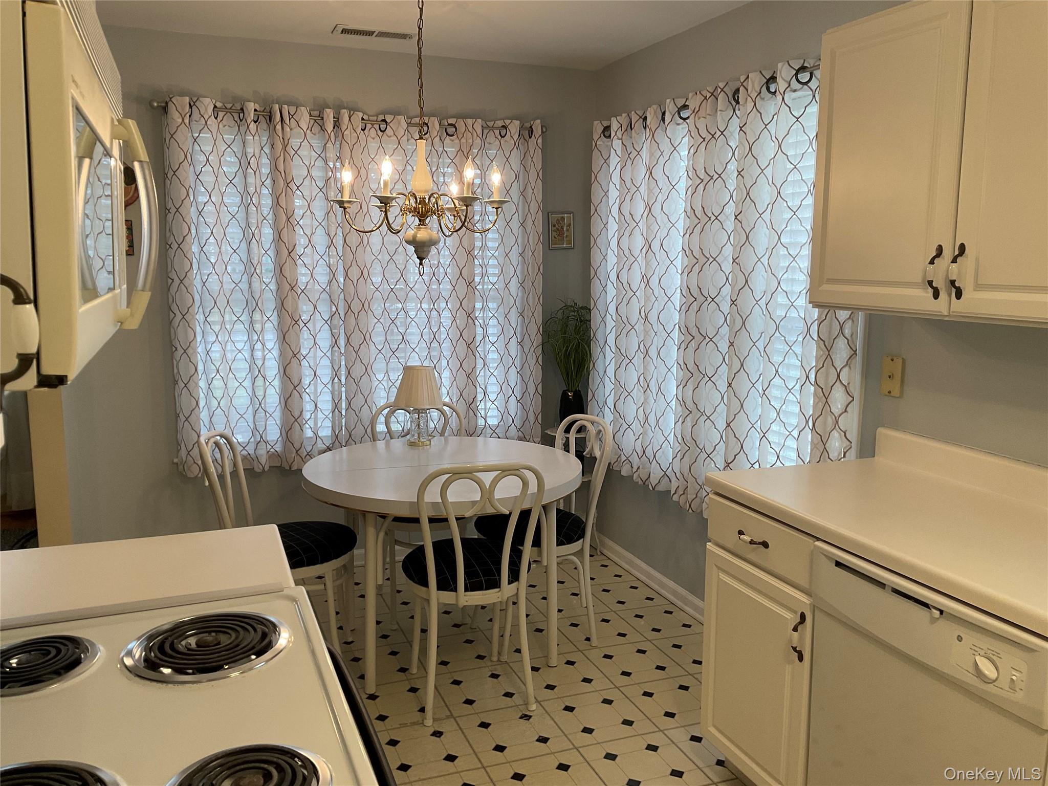 17 Tall Tree Lane Poughkeepsie, NY 12601 - Photo 5 of 31 a dining room with a table and chairs
