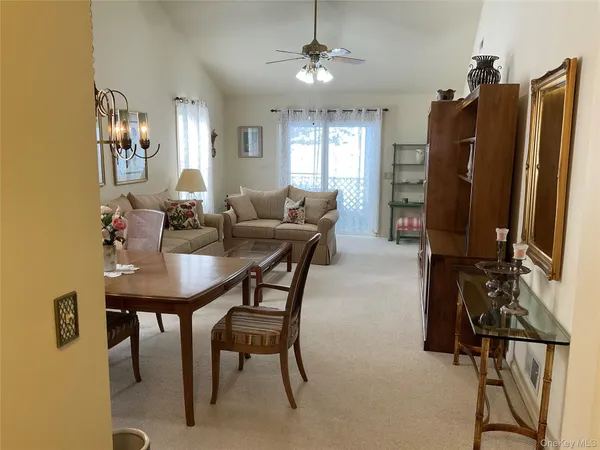 a view of a livingroom with furniture and window