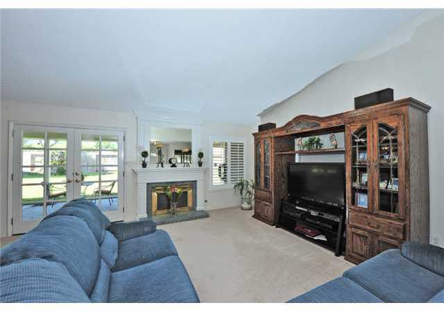 4809 Morning Canyon Road Oceanside, CA 92056 - Photo 25 of 25 Open floor plan with view to the outdoors. Notice the custom fireplace mantel.