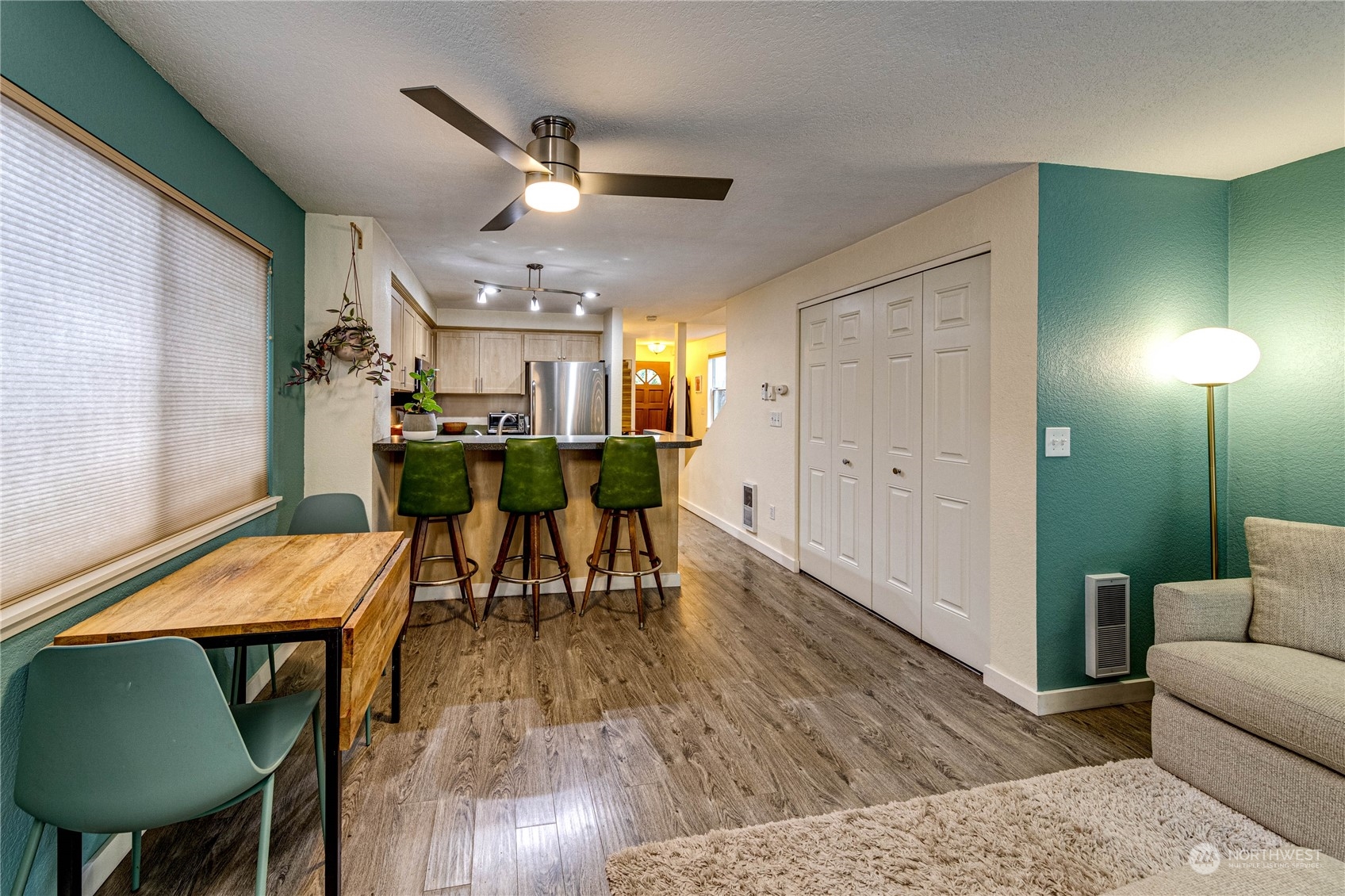 924 North 86th Street Seattle, WA 98103 - Photo 11 of 27 a view of a dining room with furniture and wooden floor