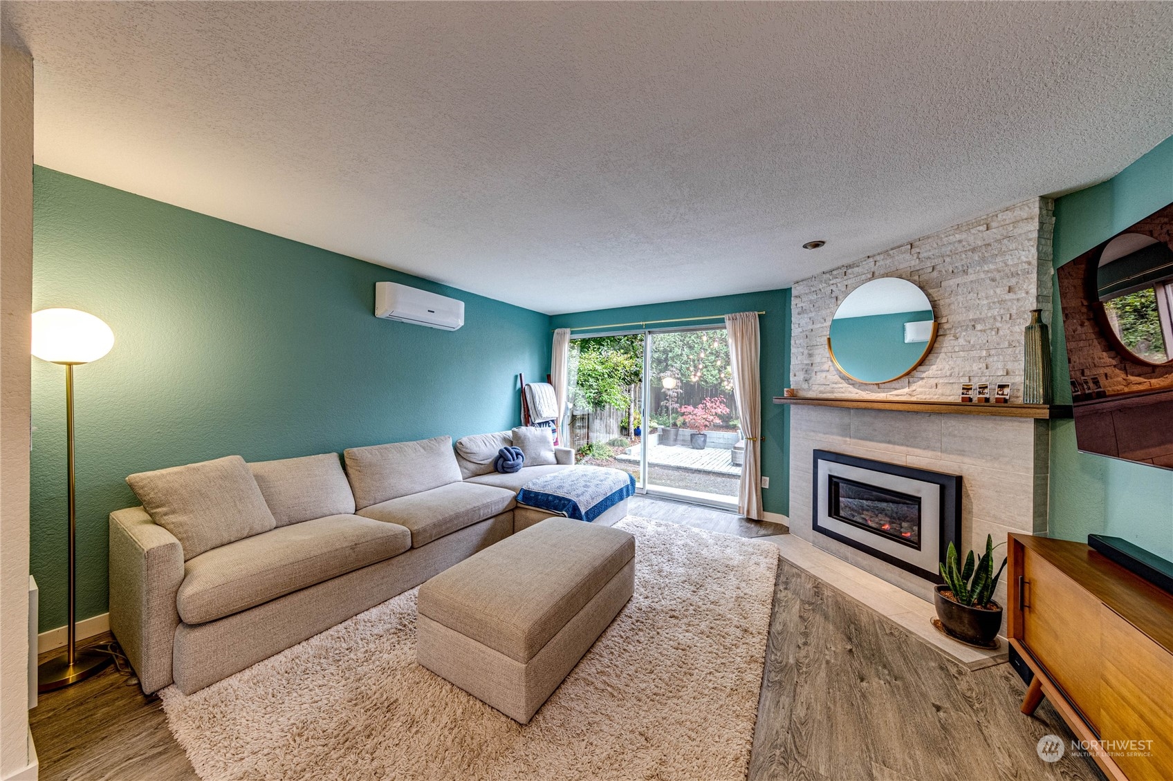 924 North 86th Street Seattle, WA 98103 - Photo 12 of 27 a living room with furniture a fireplace and a window