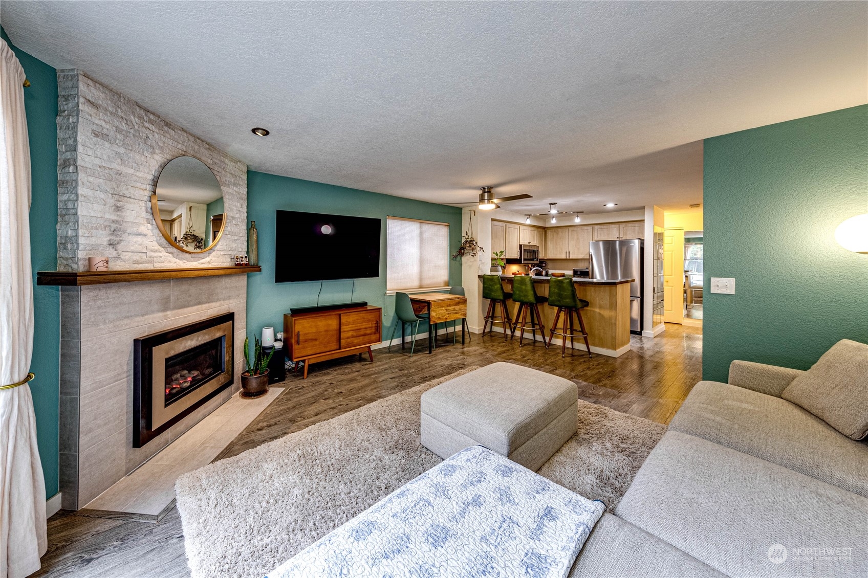 924 North 86th Street Seattle, WA 98103 - Photo 13 of 27 a living room with furniture and a flat screen tv