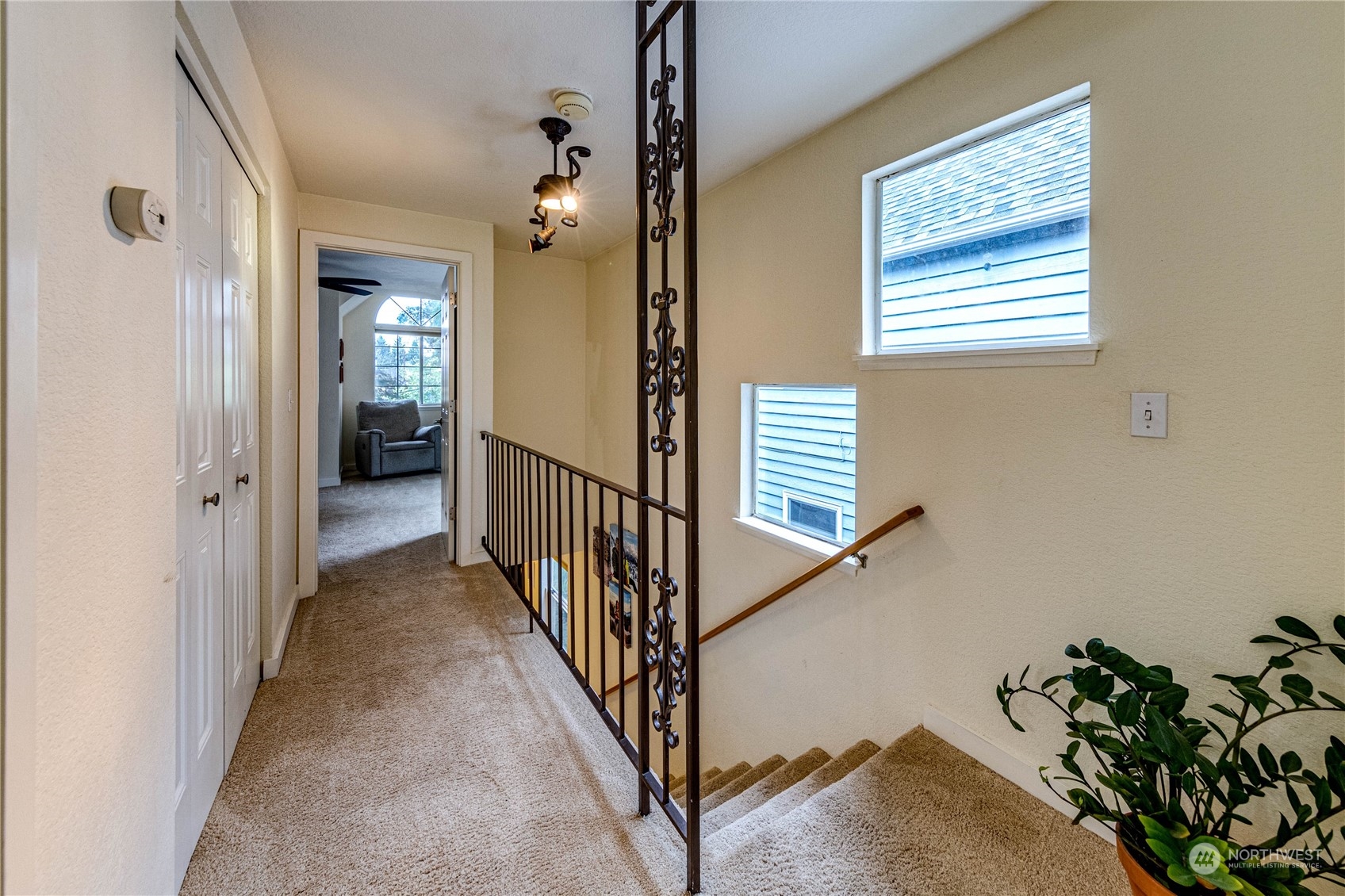 924 North 86th Street Seattle, WA 98103 - Photo 15 of 27 a view of a hallway with a window and wooden floor