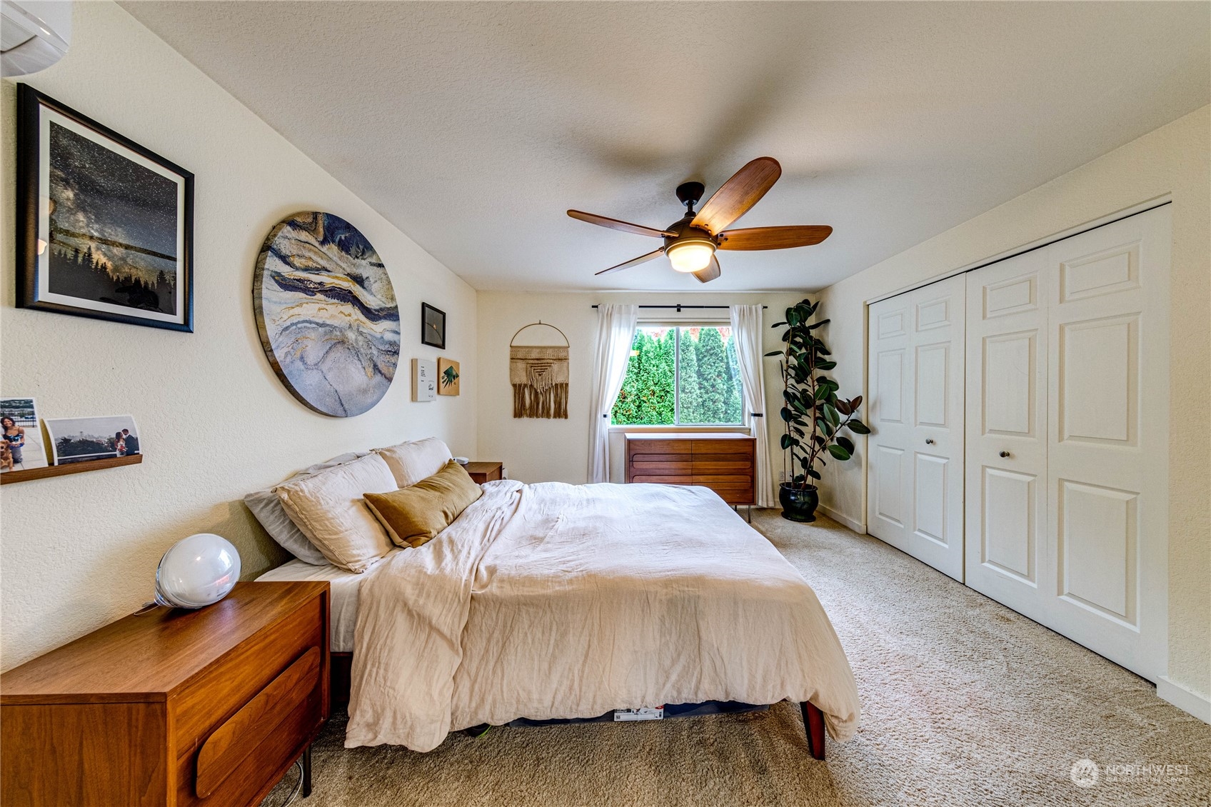 924 North 86th Street Seattle, WA 98103 - Photo 16 of 27 a bedroom with a bed and a chandelier