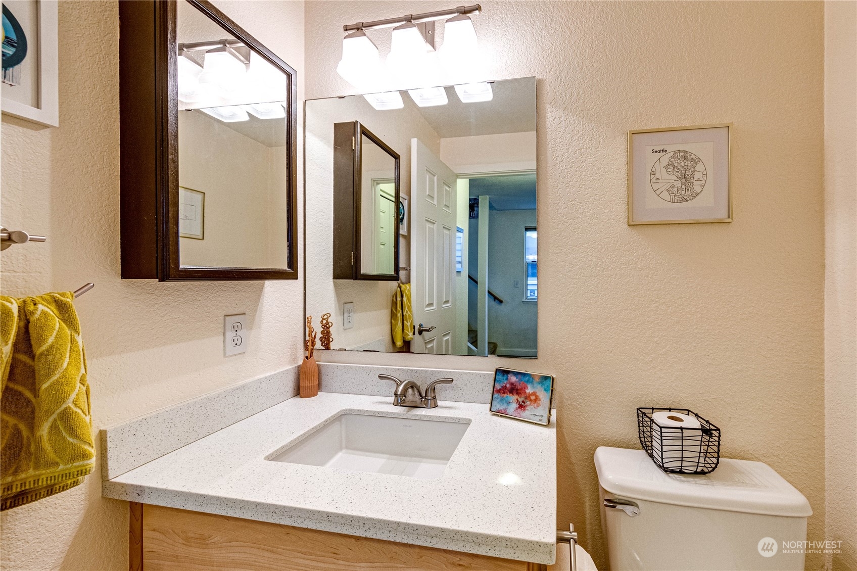 924 North 86th Street Seattle, WA 98103 - Photo 22 of 27 a bathroom with a sink and a mirror