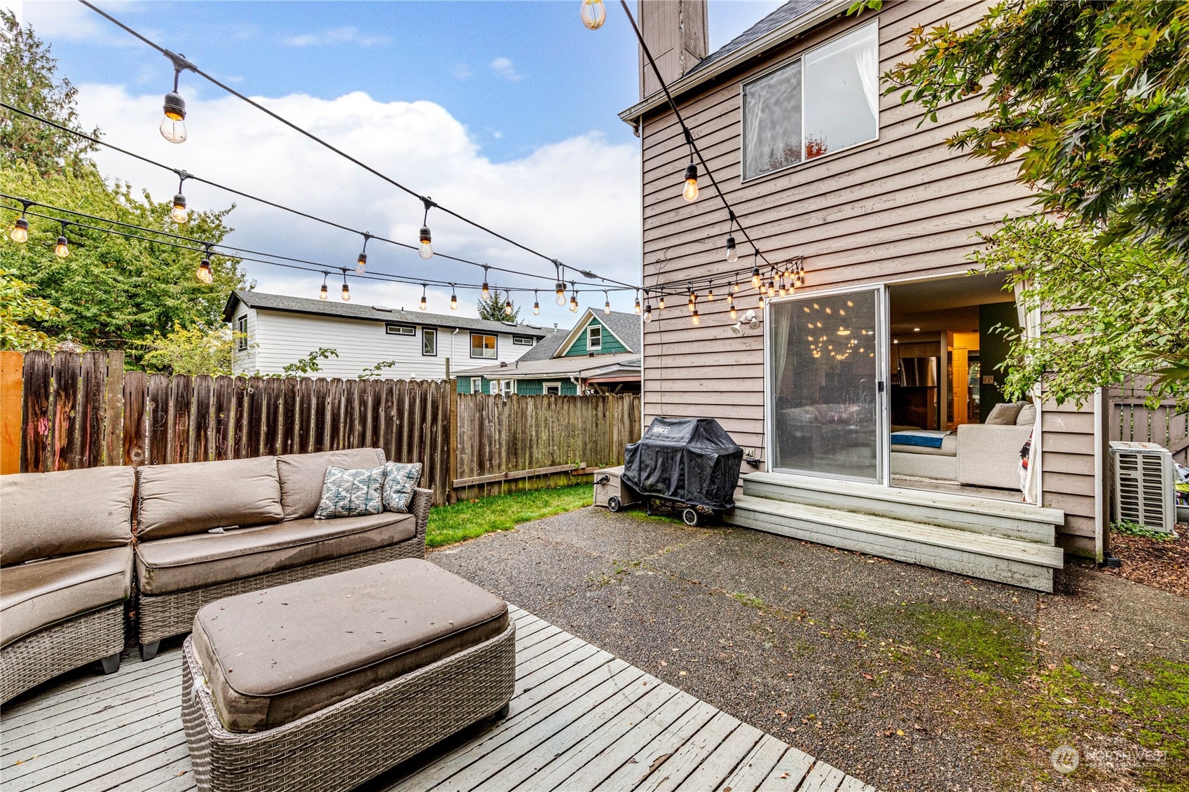 924 North 86th Street Seattle, WA 98103 - Photo 24 of 27 a view of a patio with a couch and a wooden fence