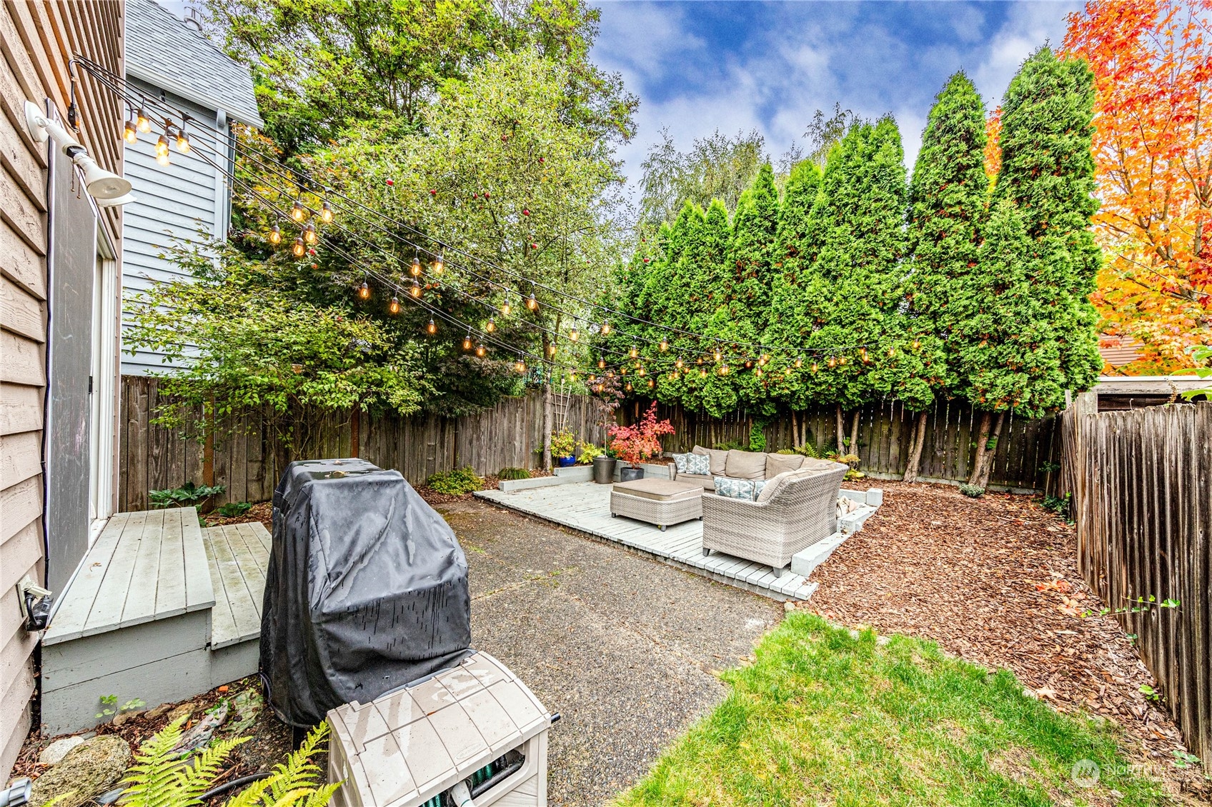 924 North 86th Street Seattle, WA 98103 - Photo 26 of 27 a view of backyard with patio