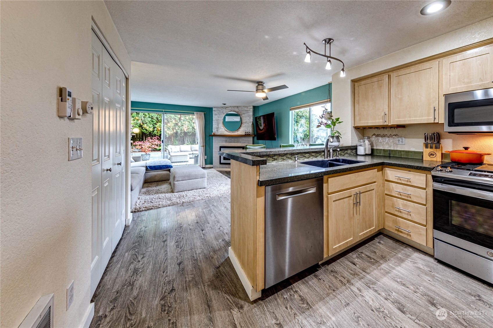 924 North 86th Street Seattle, WA 98103 - Photo 7 of 27 a kitchen with a sink stove and cabinets