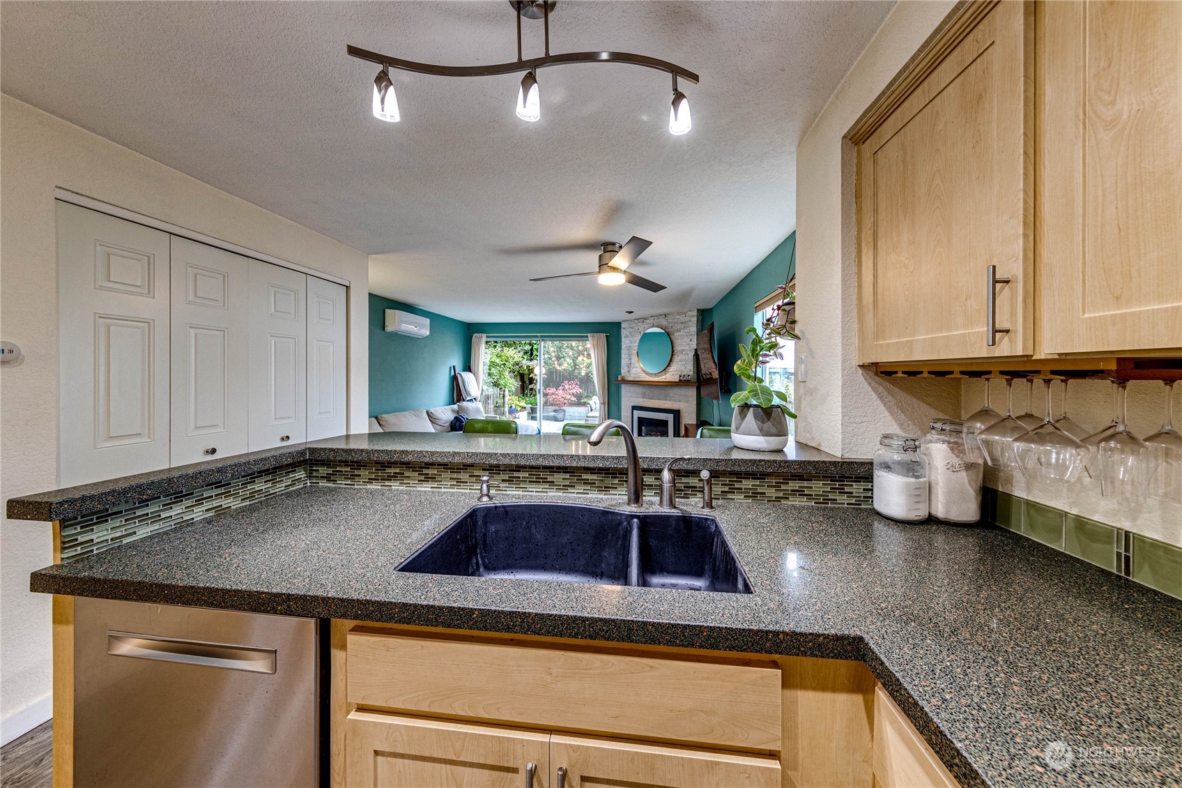 924 North 86th Street Seattle, WA 98103 - Photo 9 of 27 a kitchen with a sink and a stove top oven
