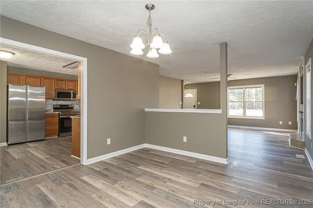 a view of a kitchen with a sink and a kitchen counter top space