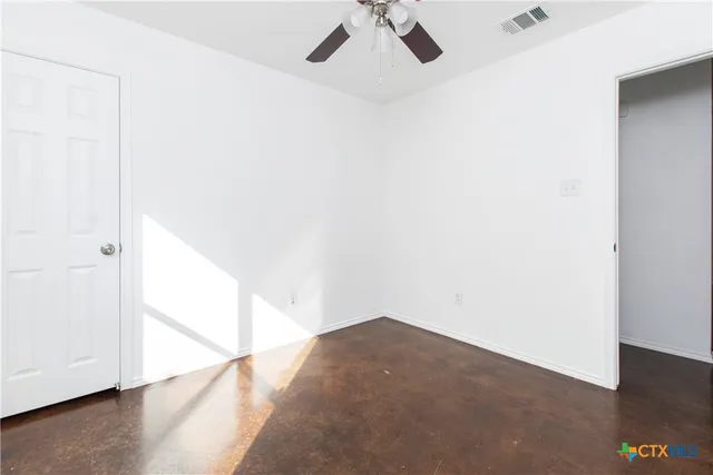 a view of a big room with closet and wooden floor
