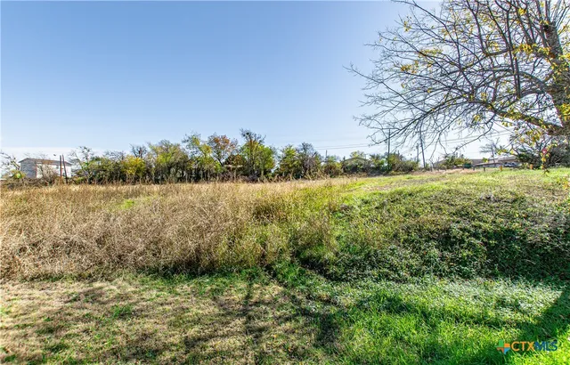 a view of lawn chairs and an ocean view