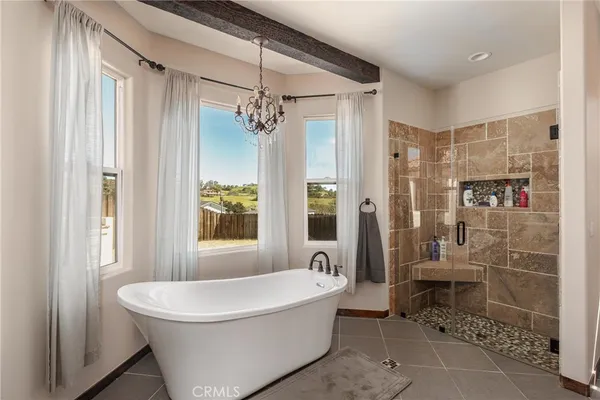 a bathroom with a bathtub and shower