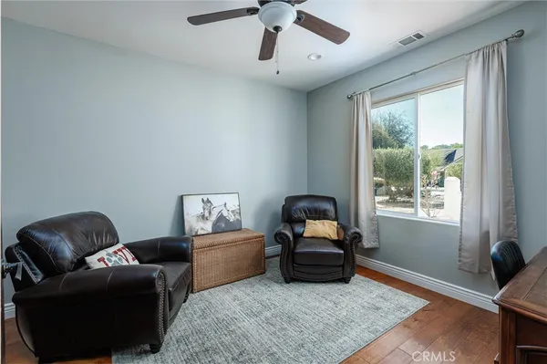a living room with furniture and a window