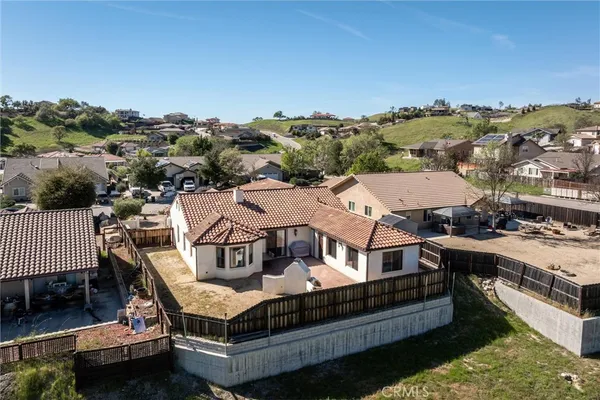a view of a house with roof deck outdoor seating and city view
