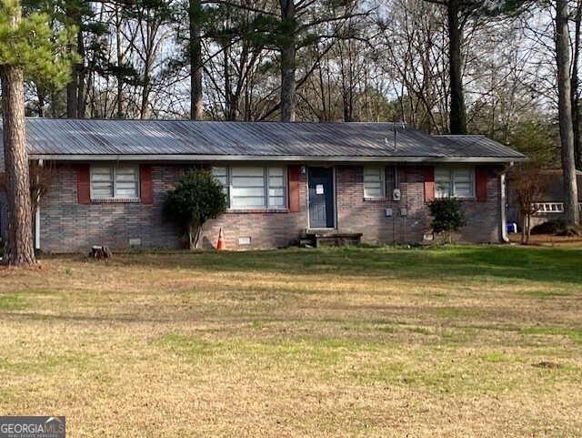 121 Sunset Drive Northeast Calhoun, GA 30701 - Photo 2 of 33 a front view of a house with a yard