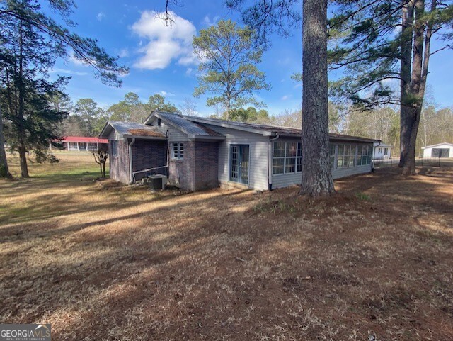 121 Sunset Drive Northeast Calhoun, GA 30701 - Photo 29 of 33 a view of a house with a yard and tree