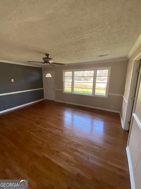 121 Sunset Drive Northeast Calhoun, GA 30701 - Photo 6 of 33 an empty room with wooden floor and windows