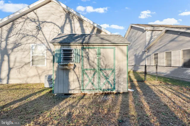 a view of a yard with a large tree