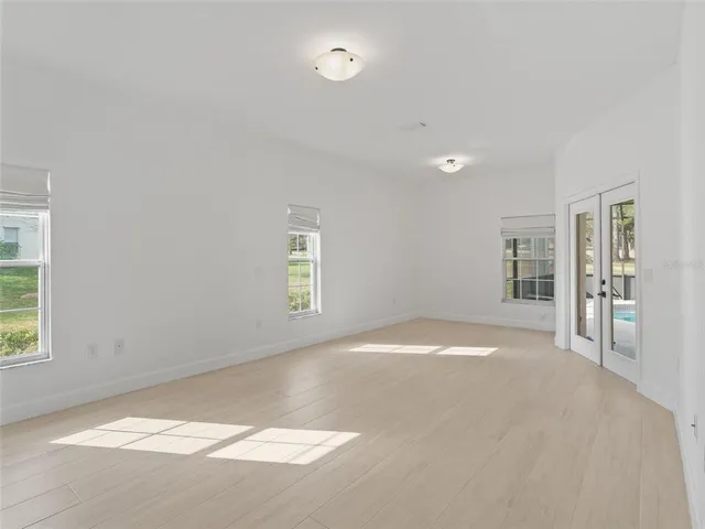 a aerial view of a house with a yard and tree