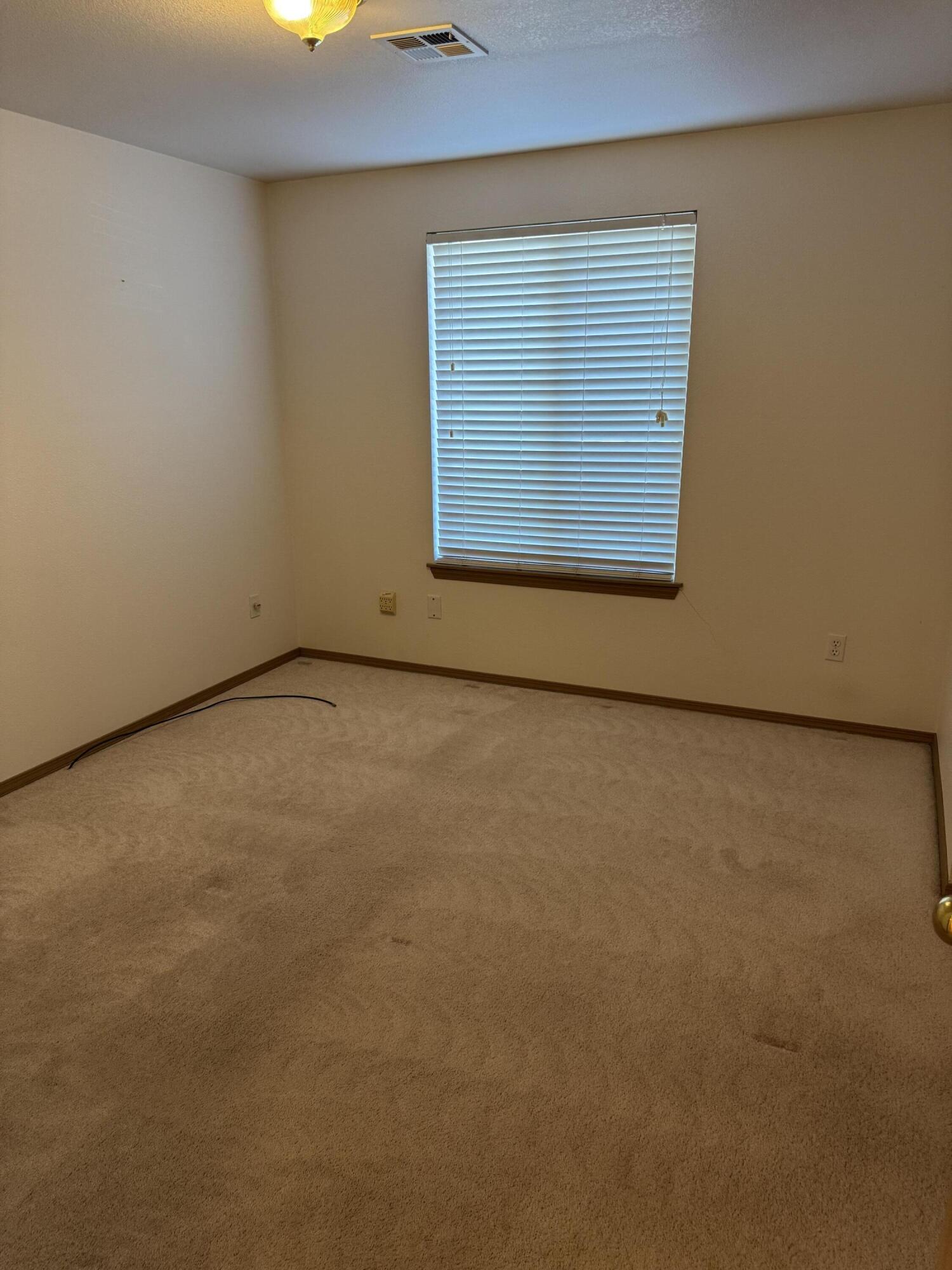7165 Old Stage Road Central Point, OR 97502 - Photo 9 of 18 a view of an empty room with a window