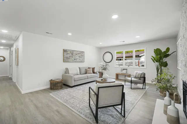 a large kitchen with stainless steel appliances granite countertop a lot of counter space and wooden cabinets