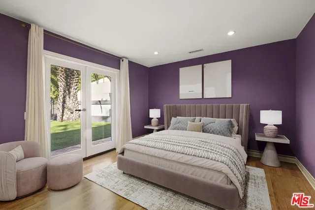 a bedroom with a balcony a bed and a couch