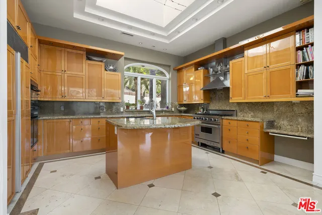 a kitchen with a sink cabinets and window