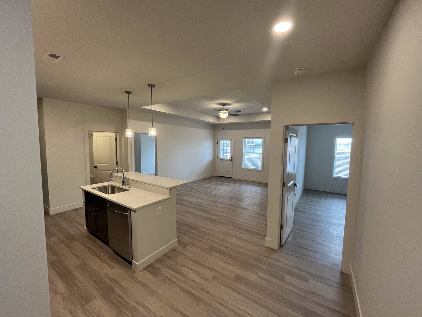 1150 Vision Circle Mahomet, IL 61853 - Photo 5 of 12 a kitchen with a sink and wooden floor