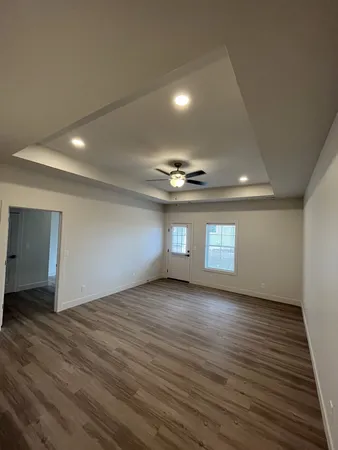 a view of a livingroom with wooden floor
