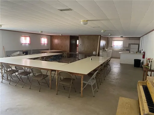 a view of a room with furniture and a window