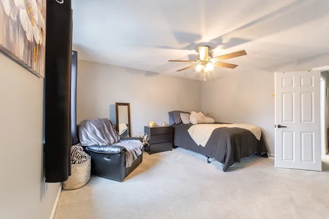 a view of a livingroom with furniture and a window
