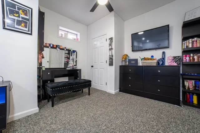 a bedroom with a bed and a walk in closet