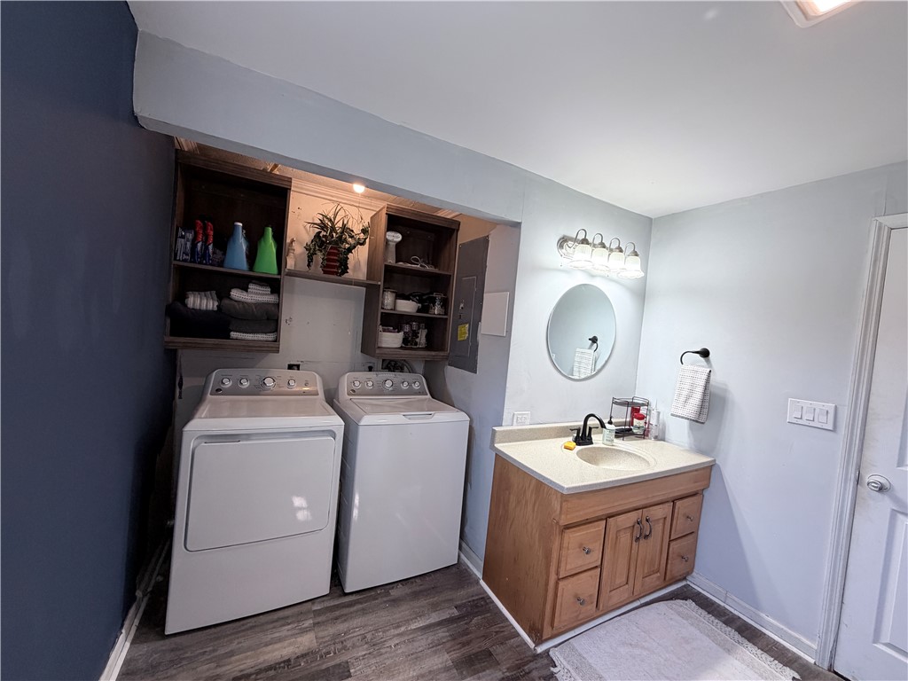 6800 Farmington Road Miamisburg, OH 45342 - Photo 19 of 32 This functional space combines laundry convenience with a practical vanity area.
