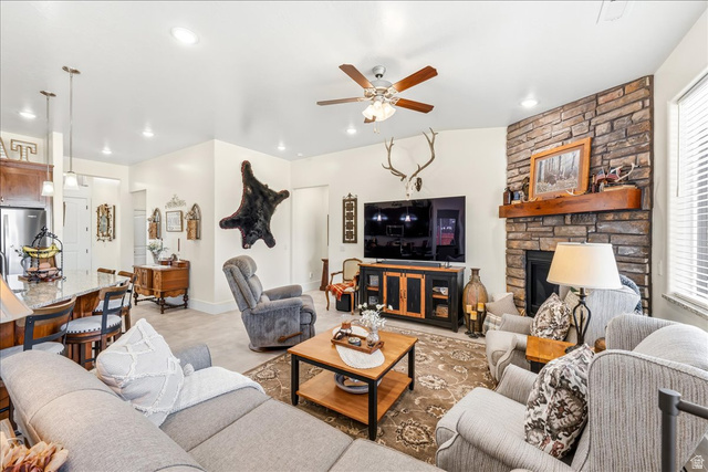 357 East Main Street Enterprise, UT 84725 - Photo 16 of 71 Living area featuring ceiling fan and a fireplace