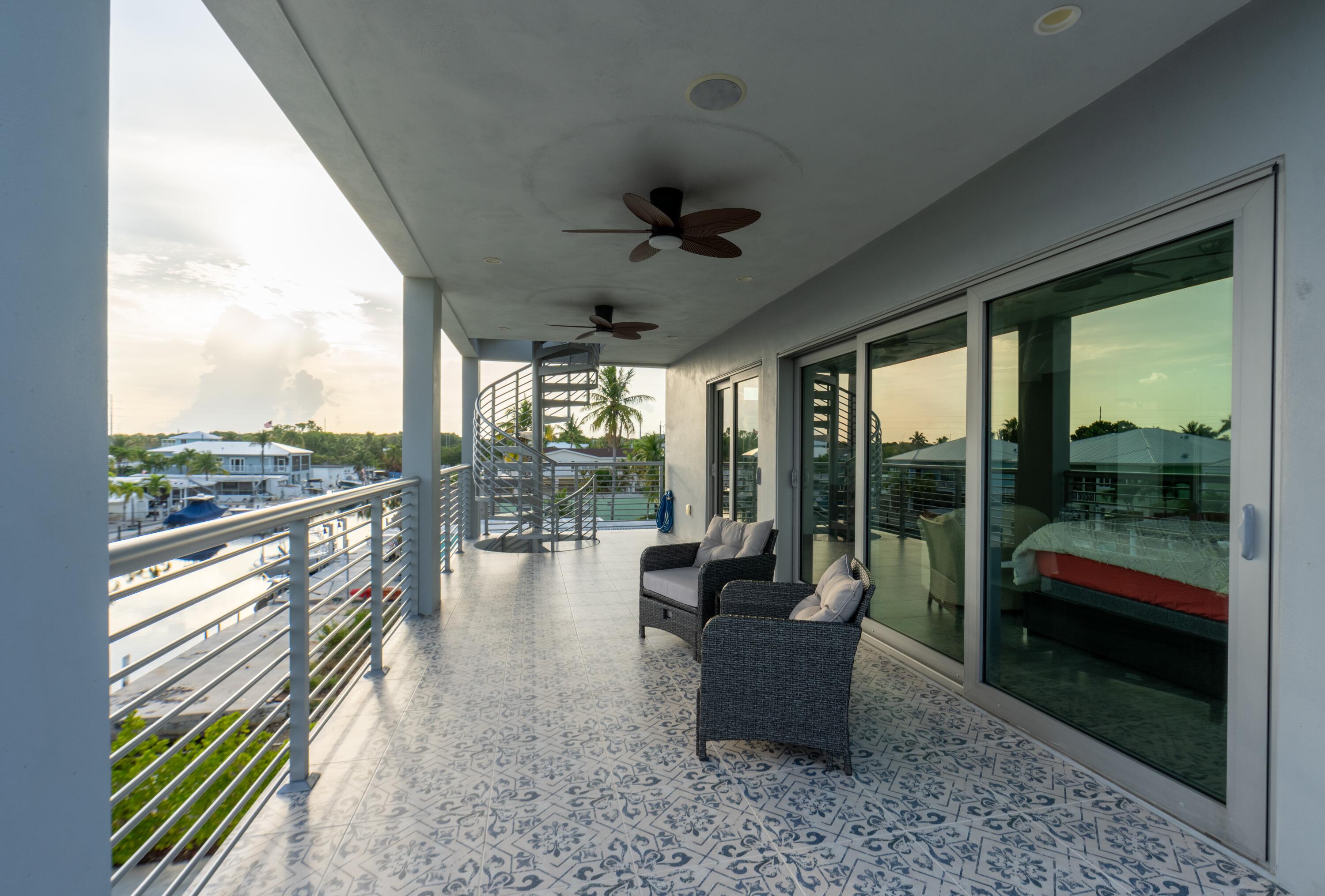475 Bahia Honda Road Key Largo, FL 33037 - Photo 44 of 134 a living room with couch and a floor to ceiling window