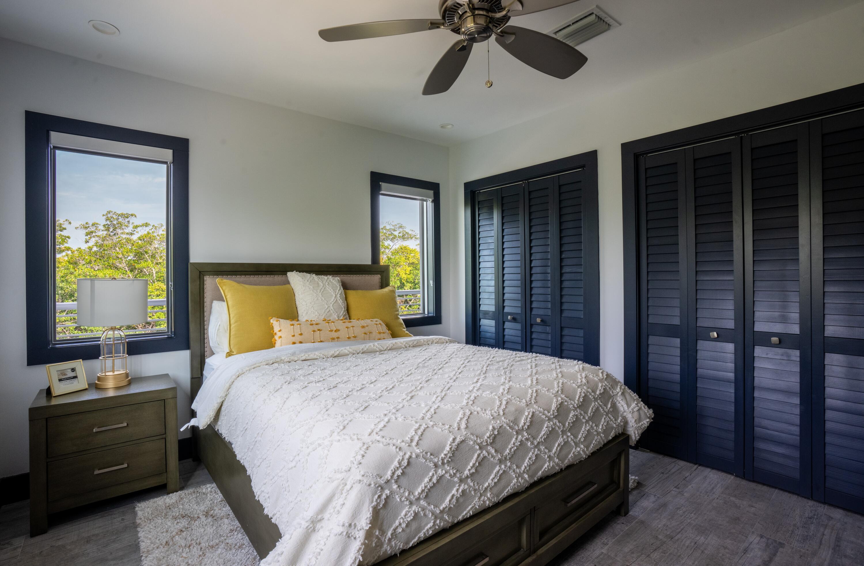 475 Bahia Honda Road Key Largo, FL 33037 - Photo 71 of 134 a bedroom with a bed and a dresser