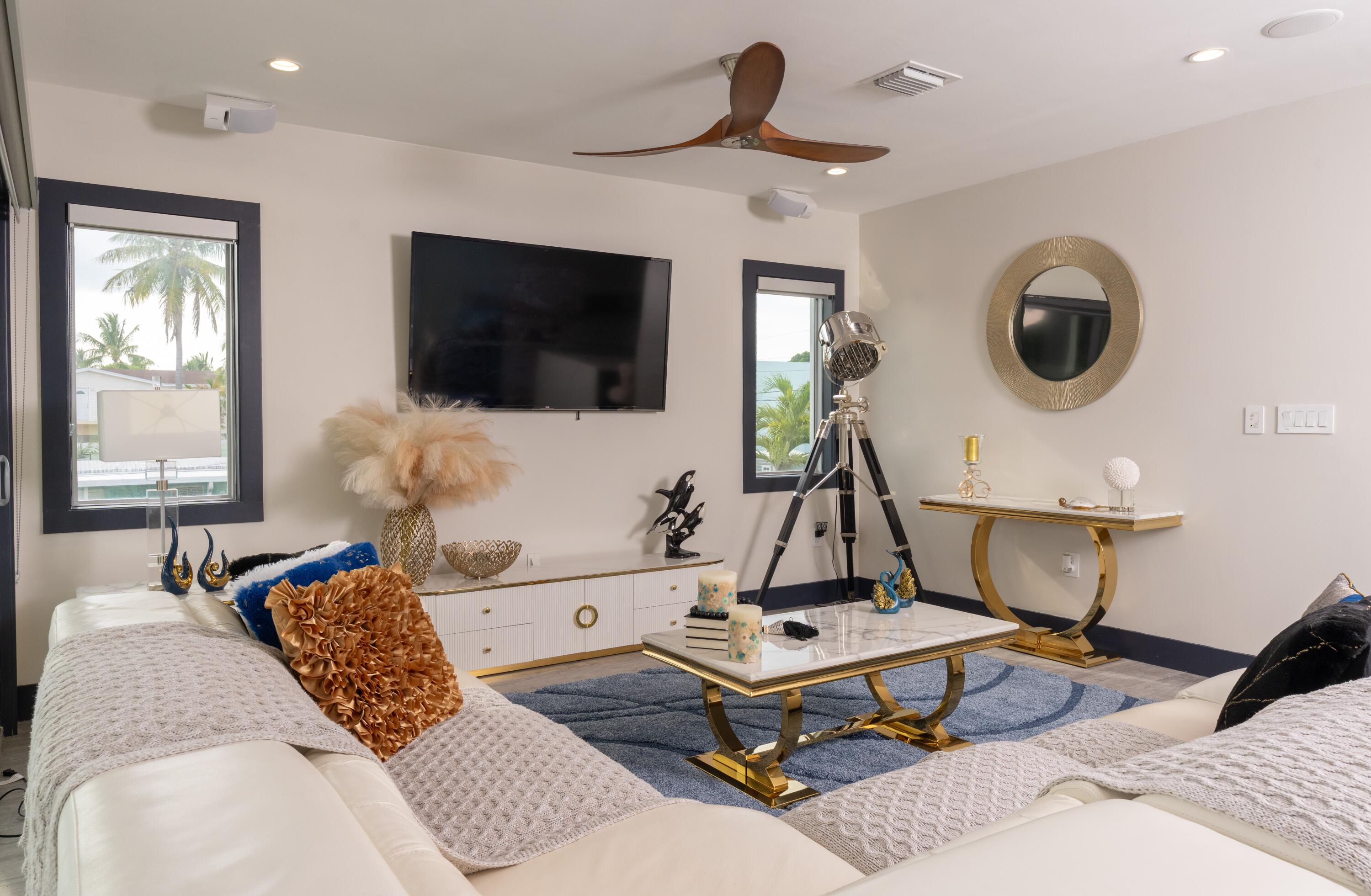 475 Bahia Honda Road Key Largo, FL 33037 - Photo 77 of 134 a living room with a couch and a flat screen tv