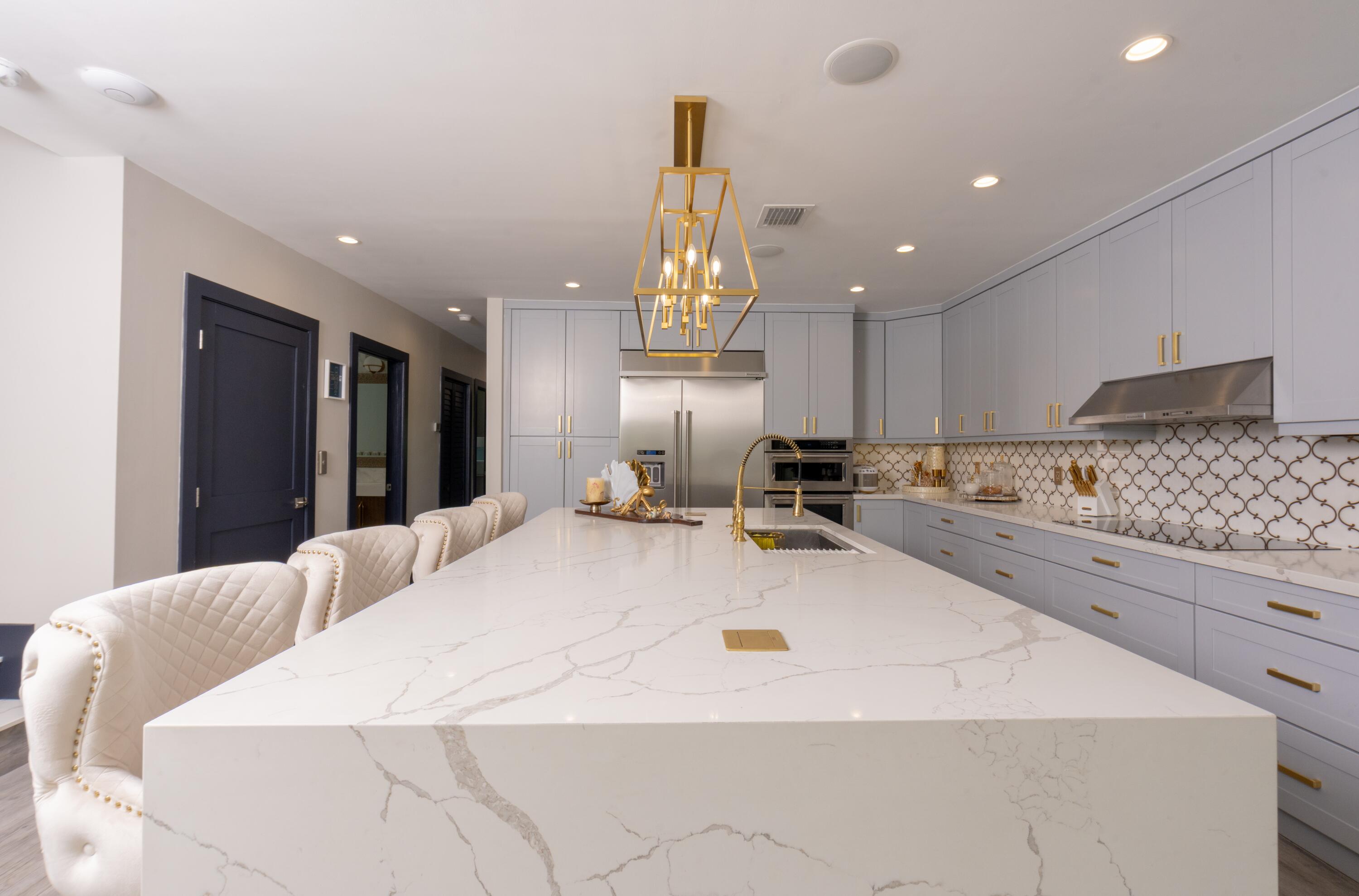 475 Bahia Honda Road Key Largo, FL 33037 - Photo 91 of 134 a large kitchen with kitchen island a large counter space appliances and cabinets